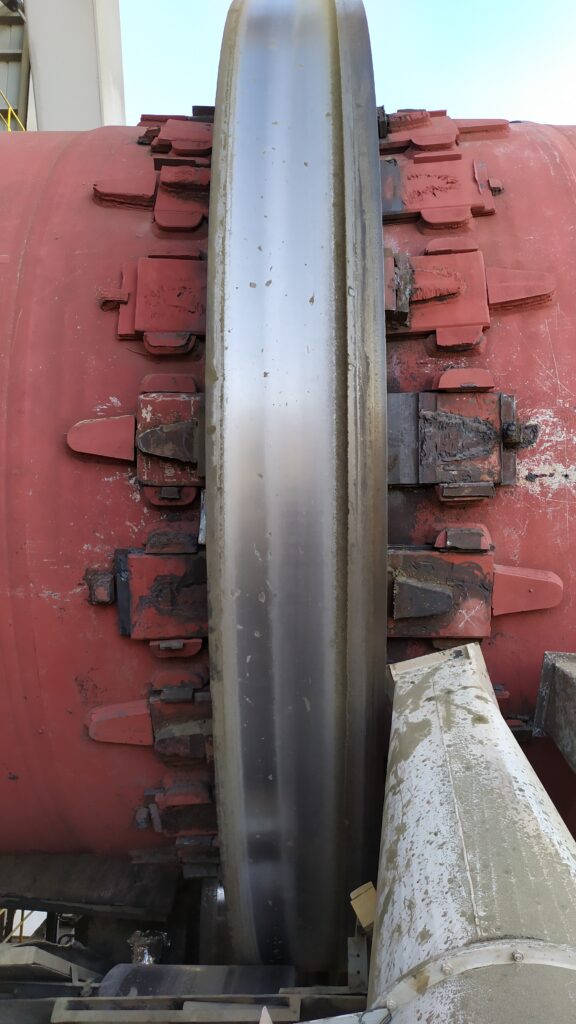 Damaged stop blocks and excessive tire thrusting on rotary kiln – issues affecting kiln performance and stability, repairable with HAVEC services.