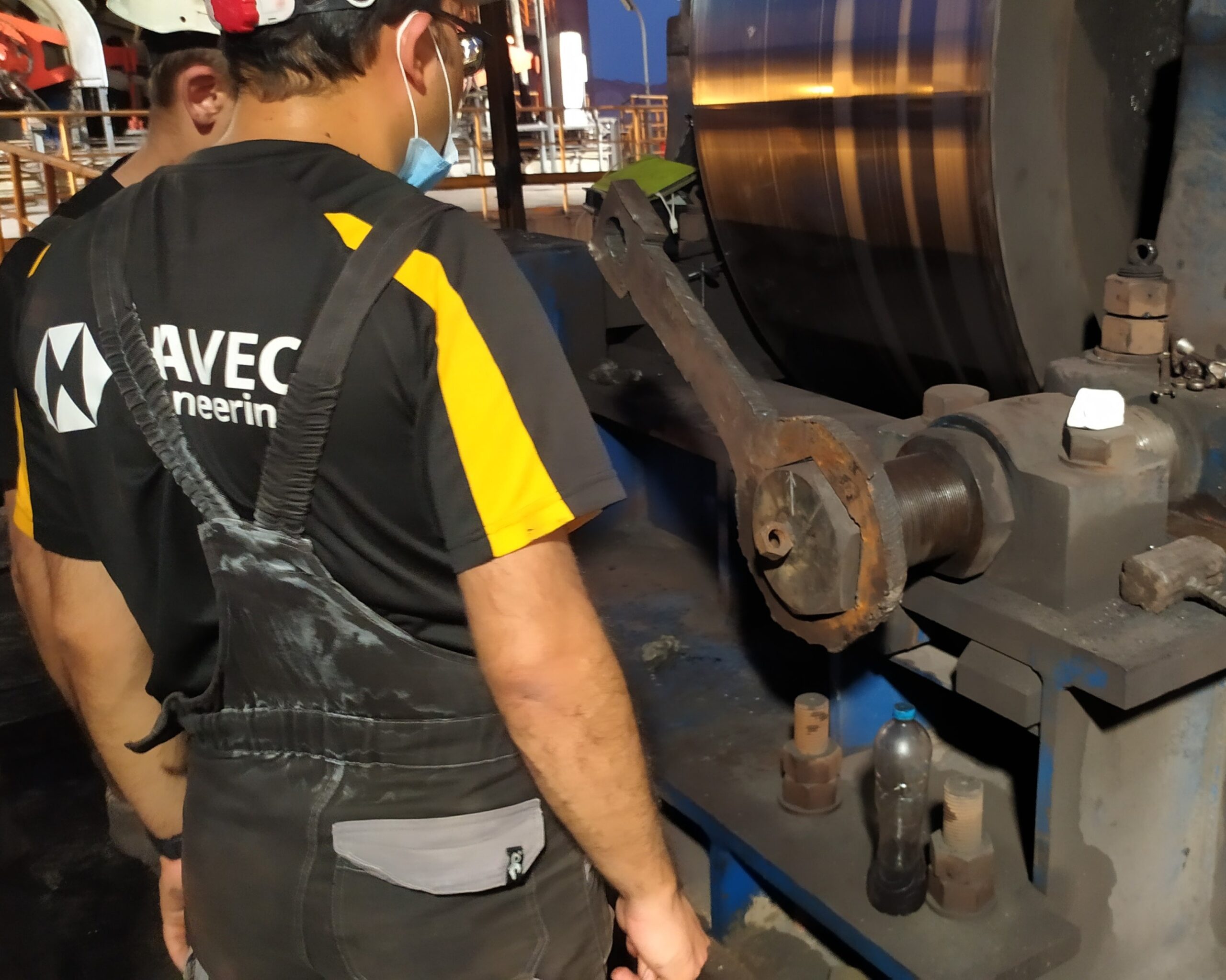 Supervision of roller adjustment in a rotary kiln, ensuring precise alignment for smooth and efficient operation.
