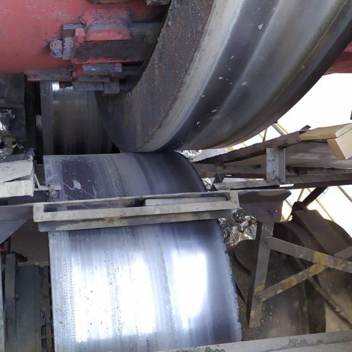 Axially shifted rotary kiln ring on roller due to tire thrusting, causing misalignment and operational instability.